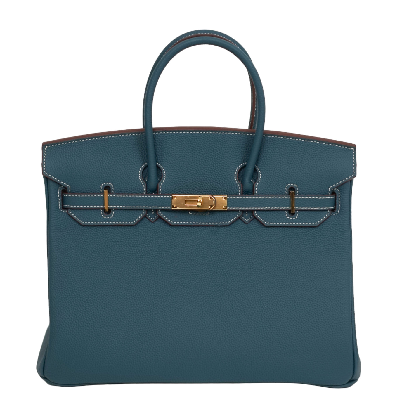Blue handbag with gold hardware on a white background