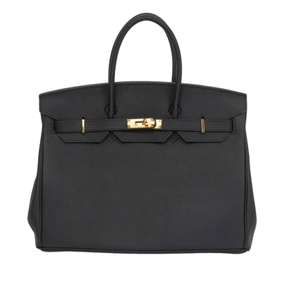 Black handbag with gold hardware on a white background
