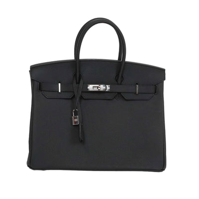 Black handbag with silver hardware on a white background