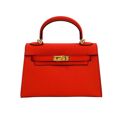 Red handbag with gold hardware on a white background