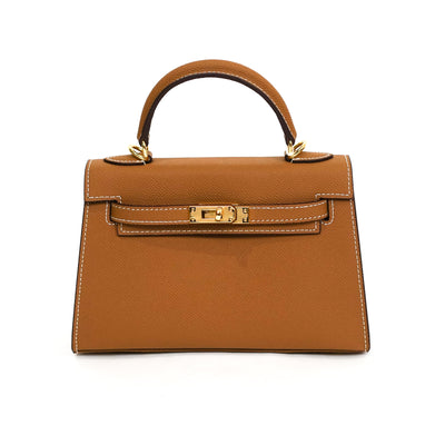 Brown handbag with gold hardware on a white background
