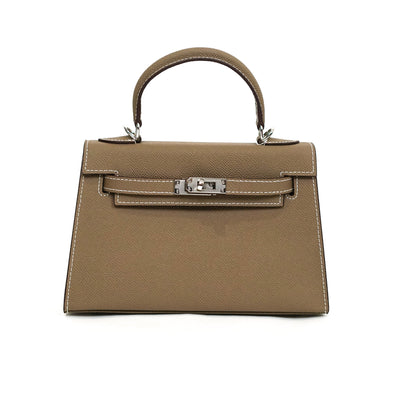 Brown handbag with a silver clasp on a white background