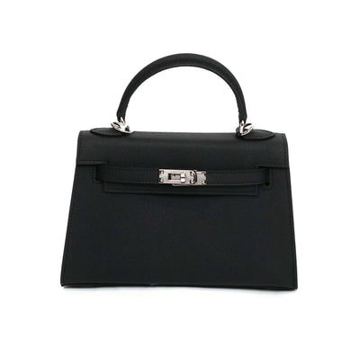 Black handbag with a silver clasp on a white background