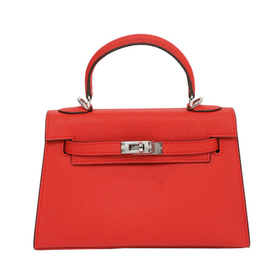 Red handbag with a silver clasp on a white background